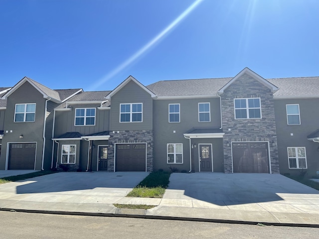 townhome / multi-family property featuring a garage