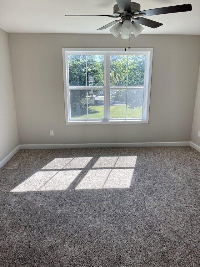 carpeted empty room with ceiling fan