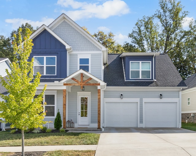 view of front of home featuring a garage and a front yard