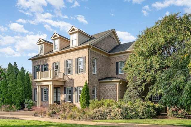 view of front of home with a balcony