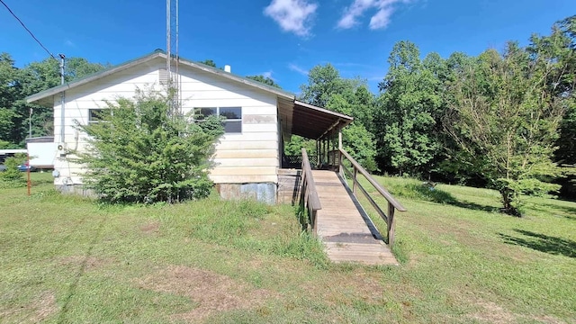 view of property exterior with a lawn