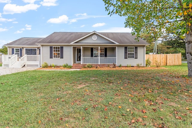 ranch-style house with a front lawn and covered porch