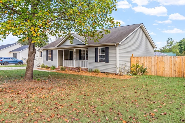 ranch-style home featuring a porch and a front yard