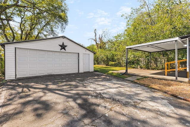 garage featuring a carport