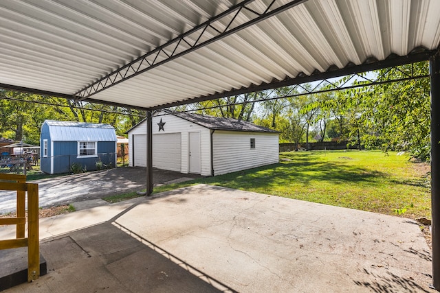 view of patio with an outdoor structure and a garage