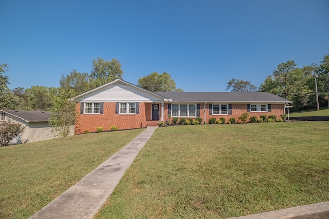 ranch-style house with a front lawn