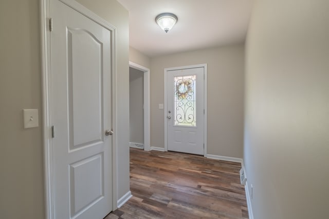 entryway with dark hardwood / wood-style floors