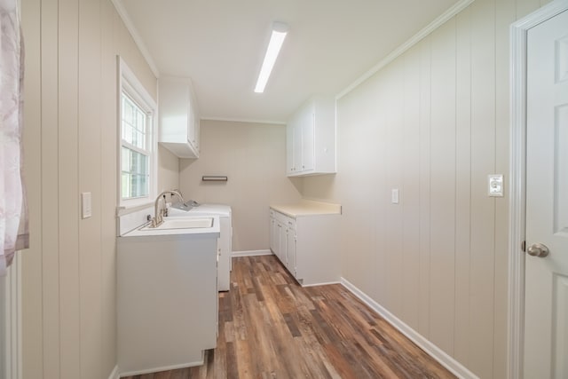 laundry area with washer / dryer, cabinets, ornamental molding, dark hardwood / wood-style floors, and sink