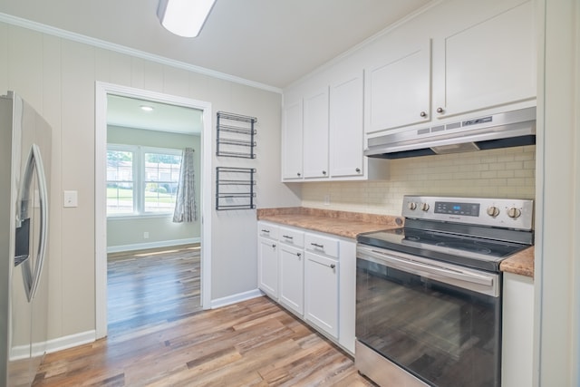 kitchen featuring stainless steel appliances, white cabinets, light hardwood / wood-style floors, and crown molding