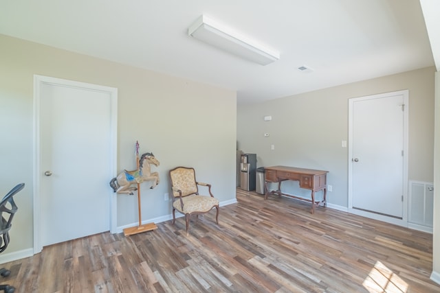 sitting room with hardwood / wood-style floors