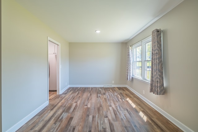 empty room featuring wood-type flooring