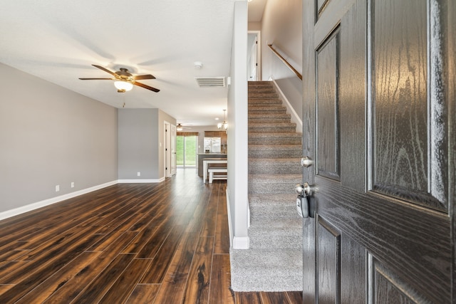 foyer with dark hardwood / wood-style flooring and ceiling fan