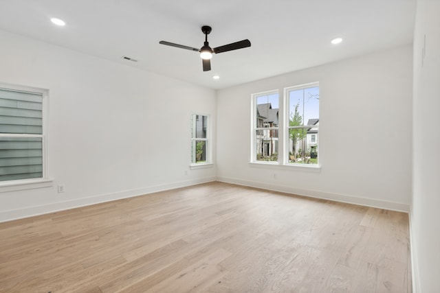 spare room with ceiling fan and light hardwood / wood-style flooring