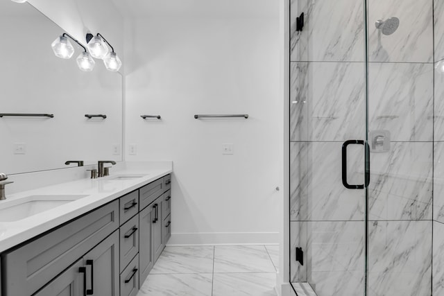 bathroom with vanity and a shower with door