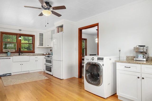 laundry room with washer / dryer, sink, crown molding, ceiling fan, and light hardwood / wood-style floors