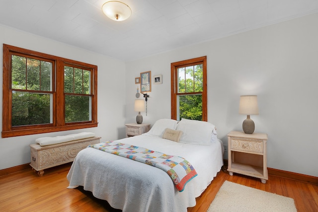 bedroom with light hardwood / wood-style floors