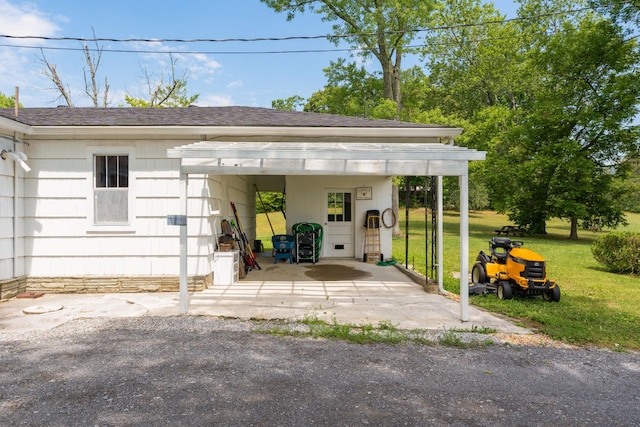 view of car parking with a carport and a yard