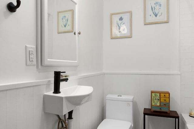 bathroom with sink and toilet