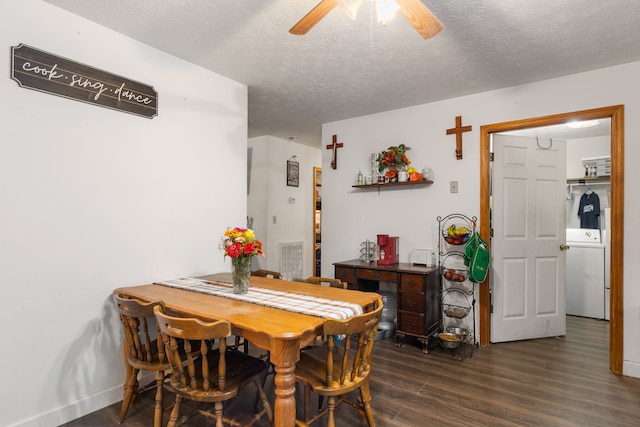 dining room featuring a textured ceiling, washer / clothes dryer, dark wood-type flooring, and ceiling fan