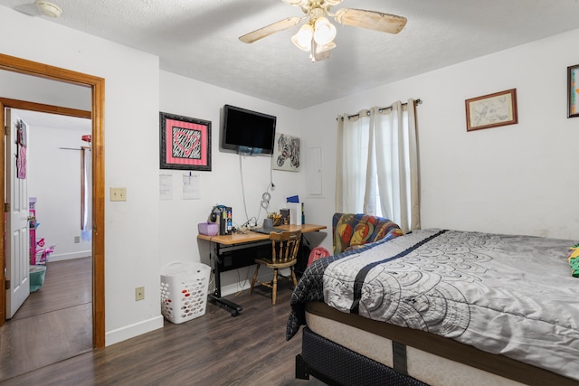 bedroom featuring ceiling fan, a textured ceiling, and dark wood-type flooring