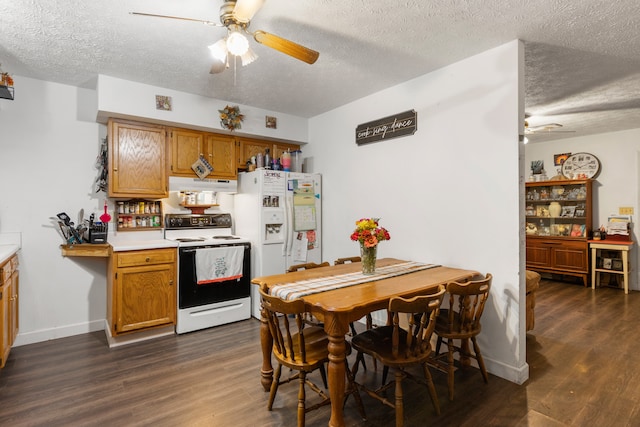 kitchen with ceiling fan, a textured ceiling, dark hardwood / wood-style floors, and white appliances