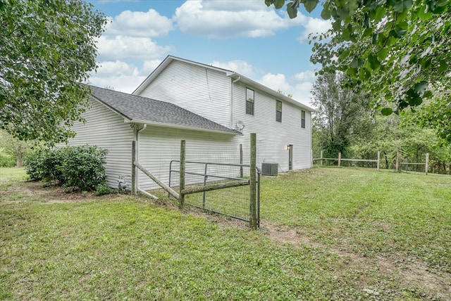 view of home's exterior featuring a lawn and cooling unit