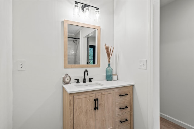 bathroom featuring hardwood / wood-style flooring and vanity