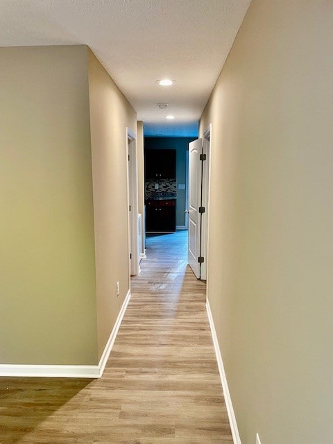 hallway featuring light hardwood / wood-style floors