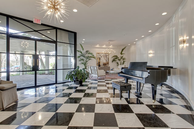 misc room featuring an inviting chandelier and crown molding