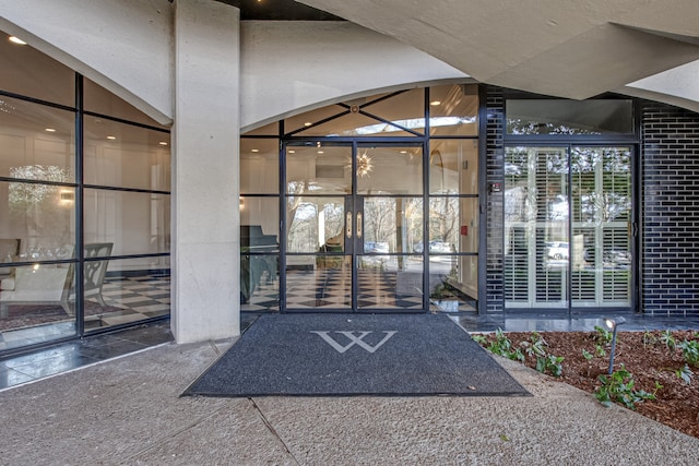 view of exterior entry featuring a patio