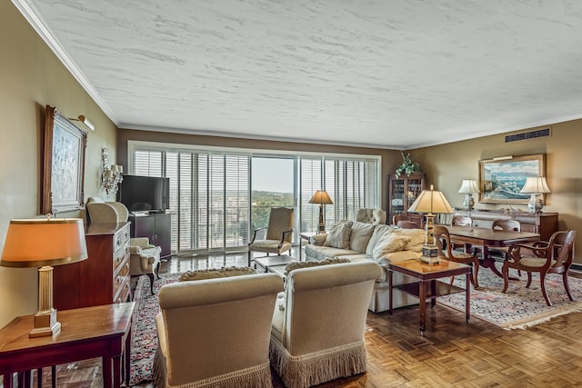 living room with a textured ceiling, crown molding, and parquet floors