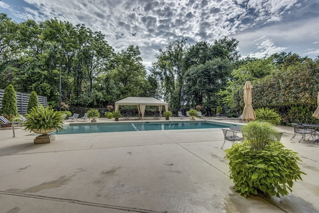 view of swimming pool with a gazebo and a patio area