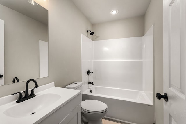 full bathroom featuring toilet, vanity, and bathing tub / shower combination