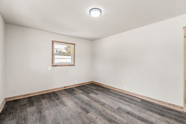 unfurnished room with wood-type flooring