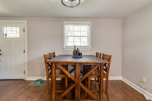 dining area featuring dark hardwood / wood-style floors