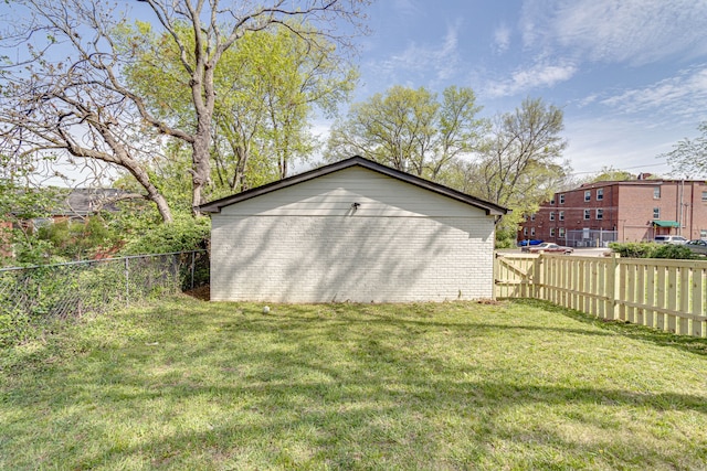 view of outdoor structure featuring a lawn