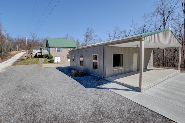 view of property exterior featuring a carport