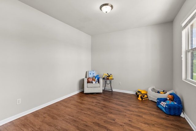 recreation room featuring dark hardwood / wood-style flooring