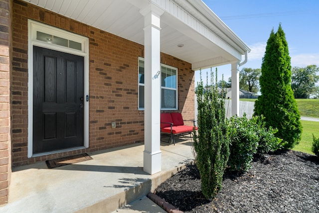 doorway to property featuring covered porch