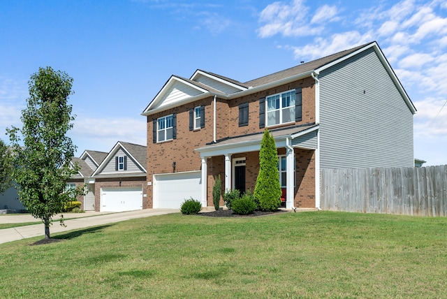 view of front of property with a garage and a front lawn