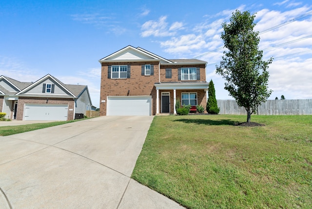 view of front of home with a garage and a front lawn