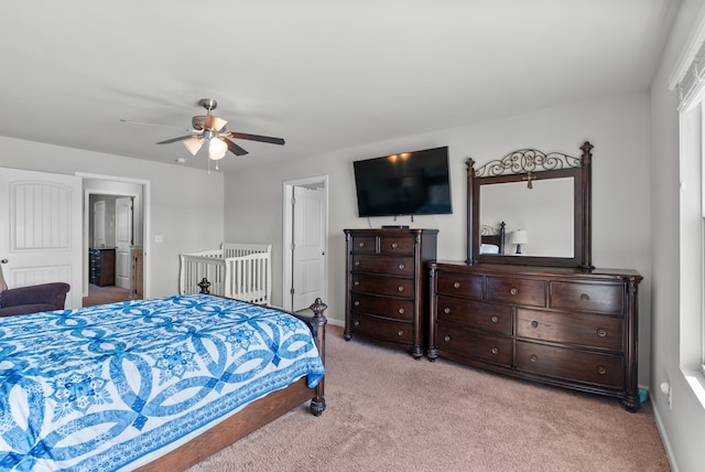 carpeted bedroom with ceiling fan