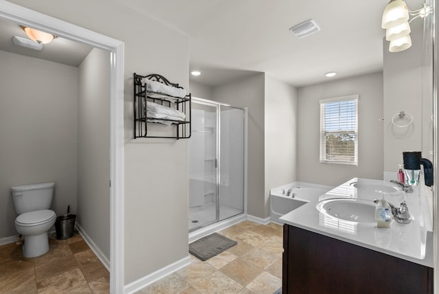 full bathroom featuring vanity, separate shower and tub, and toilet