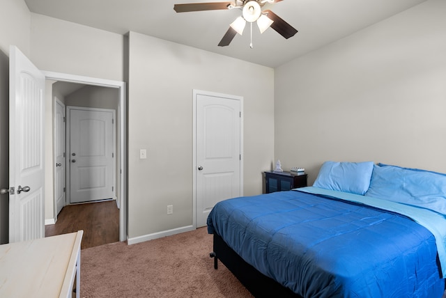 carpeted bedroom with ceiling fan