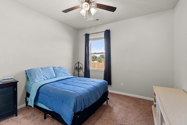 bedroom with ceiling fan and carpet