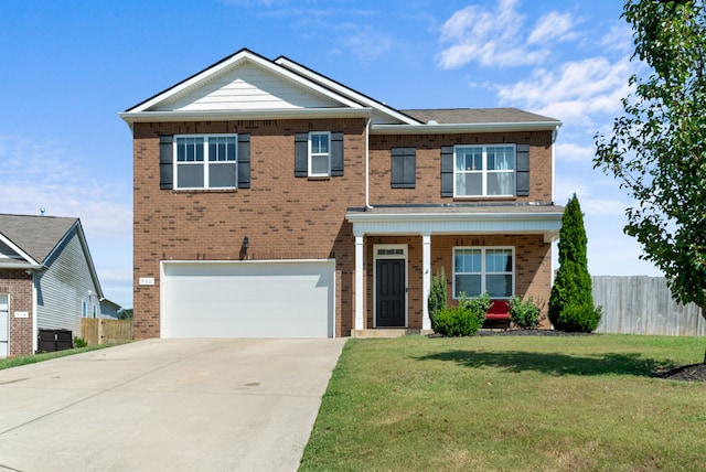 view of front facade featuring a garage and a front yard