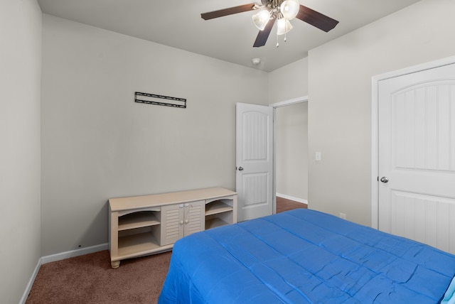 bedroom featuring ceiling fan and dark colored carpet