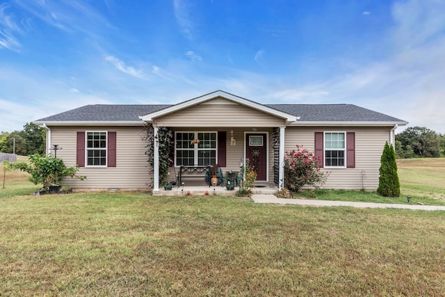 ranch-style house with a front yard and covered porch