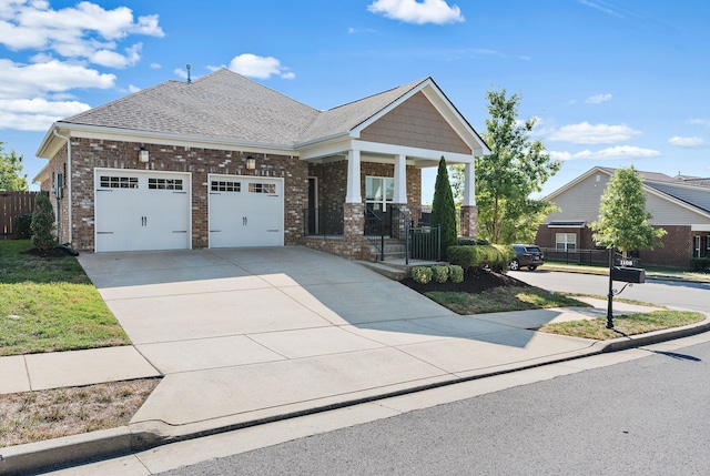 craftsman-style house featuring covered porch and a garage