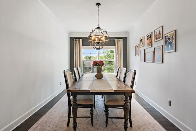 dining room with ornamental molding, dark wood-type flooring, and a notable chandelier